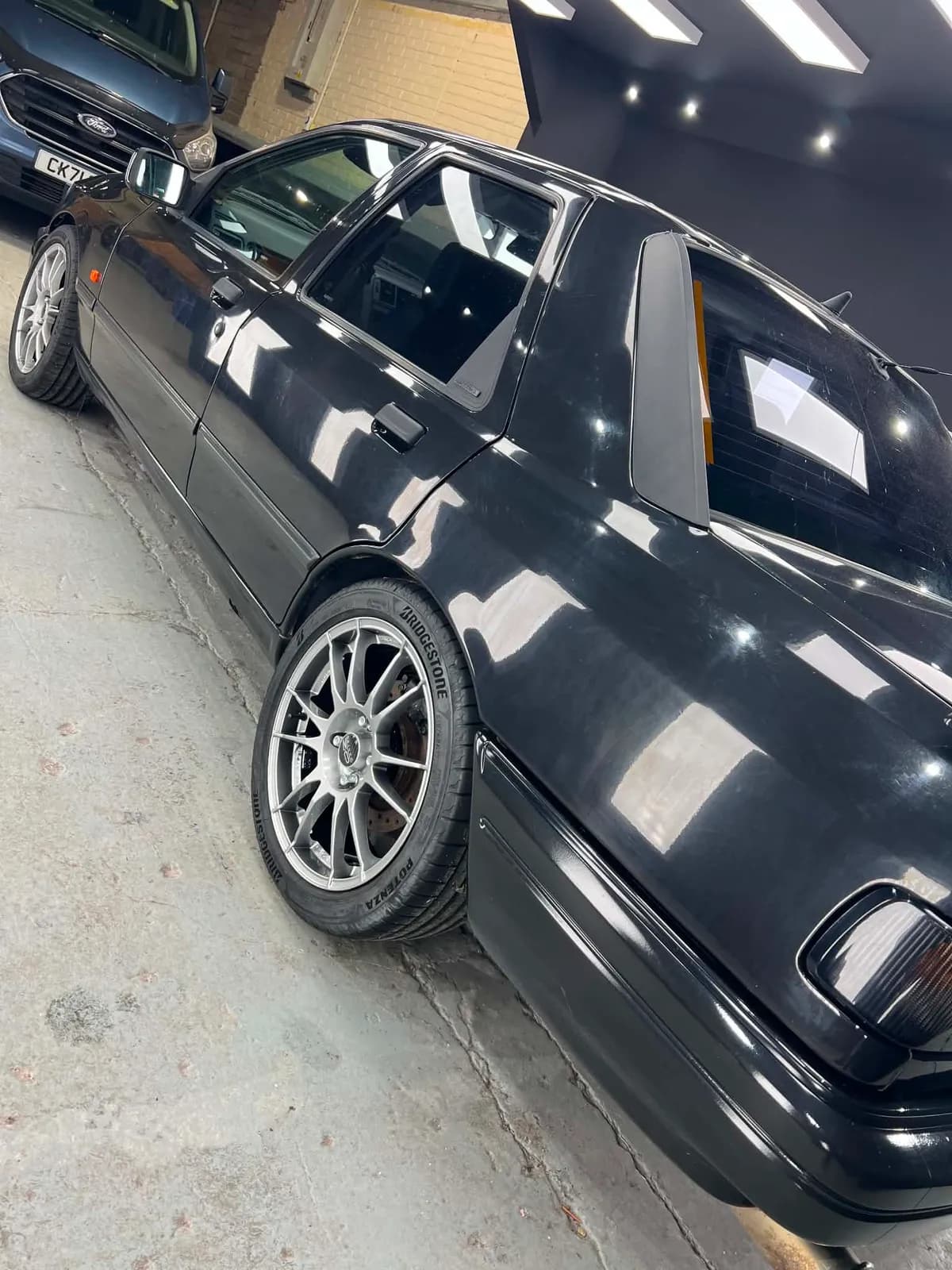 Black Ford Sierra Sapphire RS side profile after full exterior detail